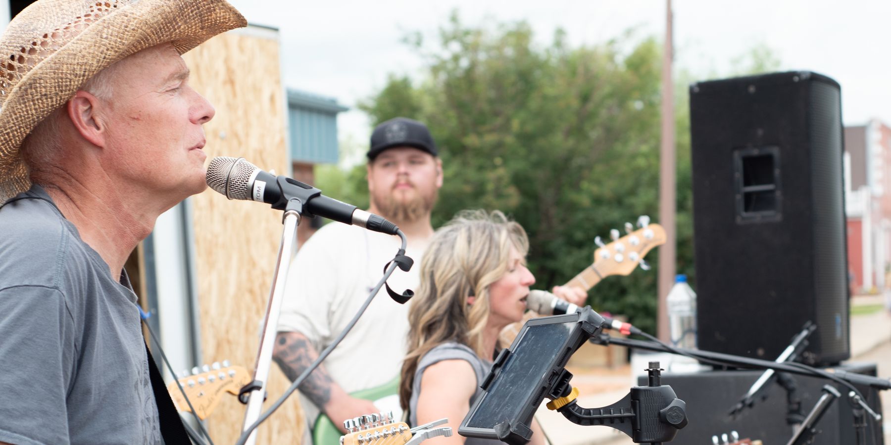 A band playing outdoors at a small town street fair